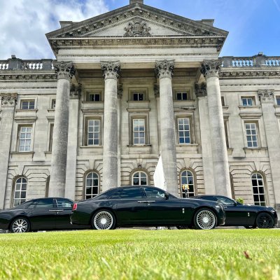 Black Rolls-Royce Ghost chauffeur cars outside a stately home