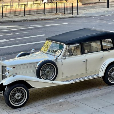 Ivory Beauford convertible vintage wedding car on a London street