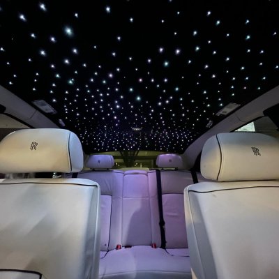 Rolls-Royce rear cabin with starlight headliner and cream leather seats