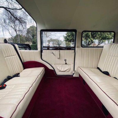 Cream and burgundy leather interior of a classic wedding limousine